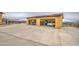 Spacious detached garage with multiple bays and plenty of parking with a large concrete apron at 8210 S 132Nd Ave, Goodyear, AZ 85338