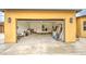 Spacious yellow detached garage offering ample storage and parking with overhead lighting at 8210 S 132Nd Ave, Goodyear, AZ 85338