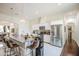 Bright, open kitchen featuring a granite countertop island with barstool seating and stainless steel appliances at 8210 S 132Nd Ave, Goodyear, AZ 85338
