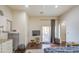Sunlit living room with hardwood floors and seamless indoor-outdoor flow to patio at 8210 S 132Nd Ave, Goodyear, AZ 85338