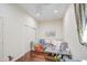 Cozy living room featuring wood floors, a ceiling fan, and a comfortable daybed at 8210 S 132Nd Ave, Goodyear, AZ 85338