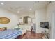 Bright living room with wood floors, a wet bar with white cabinetry, and comfortable seating at 8210 S 132Nd Ave, Goodyear, AZ 85338