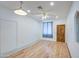 Inviting living room with hardwood floors and a striking wooden front door at 8210 S 132Nd Ave, Goodyear, AZ 85338