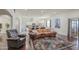 Large living room with an open floor plan, stylish rug, and modern furniture at 8210 S 132Nd Ave, Goodyear, AZ 85338