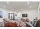 Open-concept living room featuring hardwood floors, neutral walls, and comfortable seating at 8210 S 132Nd Ave, Goodyear, AZ 85338