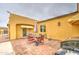An outdoor patio with brick ground covering offers an inviting space for relaxation and entertainment at 8210 S 132Nd Ave, Goodyear, AZ 85338