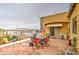 A relaxing outdoor patio features brick ground covering with views of the swimming pool at 8210 S 132Nd Ave, Goodyear, AZ 85338