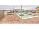 Relaxing swimming pool and hot tub area with brick ground covering and mountain views at 8210 S 132Nd Ave, Goodyear, AZ 85338