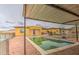 Enjoy a private backyard pool area with a hot tub, and an abundance of patio space at 8210 S 132Nd Ave, Goodyear, AZ 85338