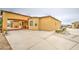 Spacious stucco home featuring a large yard and attached garage with porte-cochere at 8210 S 132Nd Ave, Goodyear, AZ 85338