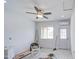 Room with tile floors, fan, recessed lighting, and an air conditioning unit above the door at 8210 S 132Nd Ave, Goodyear, AZ 85338