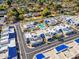Aerial view showcasing a residential community with a community pool and manicured landscaping at 10 W Georgia Ave # 8, Phoenix, AZ 85013