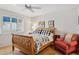 Charming bedroom with a wooden bed frame, hardwood floors, and natural light from shuttered windows at 10 W Georgia Ave # 8, Phoenix, AZ 85013