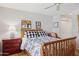 Cozy bedroom with a wood bed frame, hardwood floors, and soft, natural light at 10 W Georgia Ave # 8, Phoenix, AZ 85013