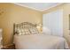 Comfortable bedroom featuring soft lighting, a bed, and ample closet space at 10 W Georgia Ave # 8, Phoenix, AZ 85013
