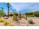 Beautifully landscaped community area featuring a decorative fountain, lush greenery, and desert plants at 10 W Georgia Ave # 8, Phoenix, AZ 85013