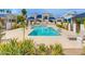 Community pool surrounded by well-manicured landscaping and cozy lounge chairs, with inviting blue tiling at 10 W Georgia Ave # 8, Phoenix, AZ 85013