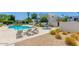 Community pool area with lounge chairs and jacuzzi, surrounded by desert landscaping at 10 W Georgia Ave # 8, Phoenix, AZ 85013