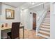 A foyer with stairs, decorative artwork, tile flooring, and a front door at 10 W Georgia Ave # 8, Phoenix, AZ 85013
