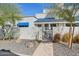 Exterior view of a charming home, with blue awning and gated patio at 10 W Georgia Ave # 8, Phoenix, AZ 85013