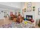 Spacious living room featuring a fireplace, plush seating, and an open layout to dining area at 10 W Georgia Ave # 8, Phoenix, AZ 85013