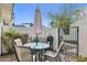 Inviting outdoor patio with an umbrella table, seating, and a BBQ grill at 10 W Georgia Ave # 8, Phoenix, AZ 85013