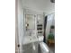 Bright bathroom featuring a modern vanity, built-in shelving, toilet, and a tiled walk-in shower with a window at 1118 S Shawnee Dr, Apache Junction, AZ 85119