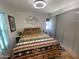 Cozy bedroom featuring a Southwest-themed bedspread, window, closet, and laminate flooring at 1118 S Shawnee Dr, Apache Junction, AZ 85119