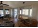 Bright dining area featuring wood floors, a bay window, and a stylish modern light fixture at 1118 S Shawnee Dr, Apache Junction, AZ 85119