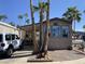 Beautiful home exterior with a covered patio, set in a tropical landscape at 1118 S Shawnee Dr, Apache Junction, AZ 85119