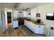 Bright kitchen featuring white cabinets, a breakfast nook, and modern appliances at 1118 S Shawnee Dr, Apache Junction, AZ 85119