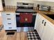 Stainless steel range stove and wooden counter tops with white cabinets at 1118 S Shawnee Dr, Apache Junction, AZ 85119