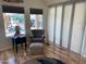 Bright living room with wood floors, and large windows overlooking the community at 1118 S Shawnee Dr, Apache Junction, AZ 85119