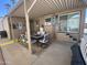 Outdoor covered patio with seating, and close proximity to the main house at 1118 S Shawnee Dr, Apache Junction, AZ 85119