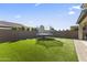 Green backyard featuring artificial turf, and trampoline at 11607 W Marguerite Ave, Avondale, AZ 85323