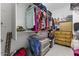 Walk-in closet with organized storage solutions and ample hanging space at 11607 W Marguerite Ave, Avondale, AZ 85323