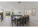 Open-concept dining area with large windows and ample space for entertaining guests at 11607 W Marguerite Ave, Avondale, AZ 85323