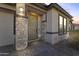 The house features a stone pillar entrance and Vivint home security system at 11607 W Marguerite Ave, Avondale, AZ 85323
