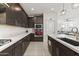 A modern kitchen featuring stainless steel appliances, sleek countertops, and ample cabinet space at 11607 W Marguerite Ave, Avondale, AZ 85323