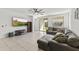 A spacious living room with stylish sectional seating and modern entertainment center at 11607 W Marguerite Ave, Avondale, AZ 85323