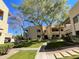 Beautifully landscaped community grounds with mature trees and manicured lawns at 145 N 74Th St # 236, Mesa, AZ 85207