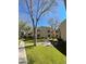 Exterior view of community buildings, grilling area, and lush landscaping at 145 N 74Th St # 236, Mesa, AZ 85207