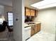 Functional kitchen featuring ample counter space, classic wooden cabinets, white appliances and tile floor at 145 N 74Th St # 236, Mesa, AZ 85207