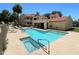Community pool with a built-in hot tub and ample lounge space at 145 N 74Th St # 236, Mesa, AZ 85207