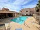 Inviting community pool with plenty of lounge chairs under sunny skies at 145 N 74Th St # 236, Mesa, AZ 85207