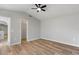 Bedroom features vaulted ceiling, wood-look flooring, walk-in closet and neutral paint at 1518 E Mineral Rd, Gilbert, AZ 85234