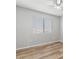 Bedroom featuring wood-look floors and window at 1518 E Mineral Rd, Gilbert, AZ 85234