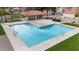 Sparkling community pool with ample lounge space and a covered ramada, perfect for relaxation and recreation at 1518 E Mineral Rd, Gilbert, AZ 85234