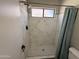 Newly renovated shower with white marble-look tile at 1518 E Mineral Rd, Gilbert, AZ 85234