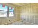 Unfinished bedroom featuring large windows, drywall, and natural light from outside at 15709 W Beryl Ave, Waddell, AZ 85355
